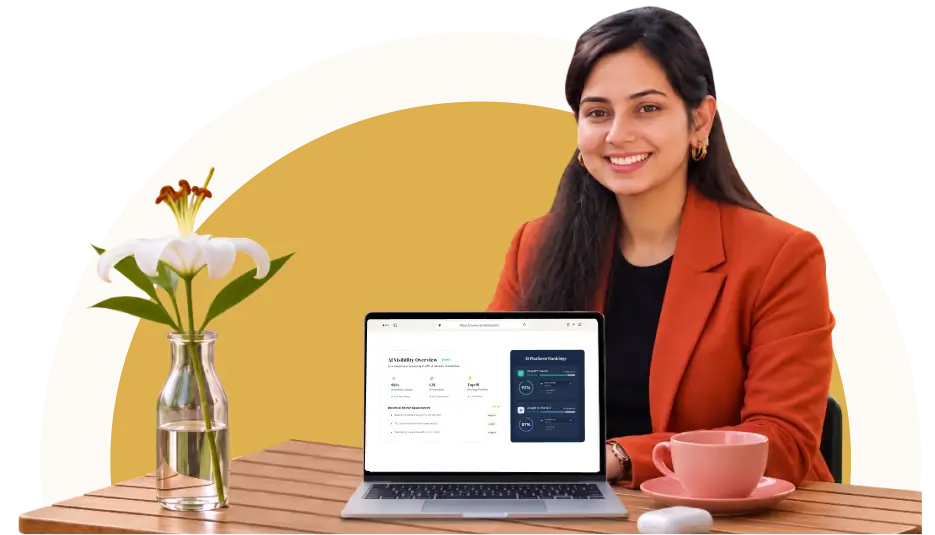 Woman sitting at a table with a laptop computer, a cup of coffee, a saucer, a mouse